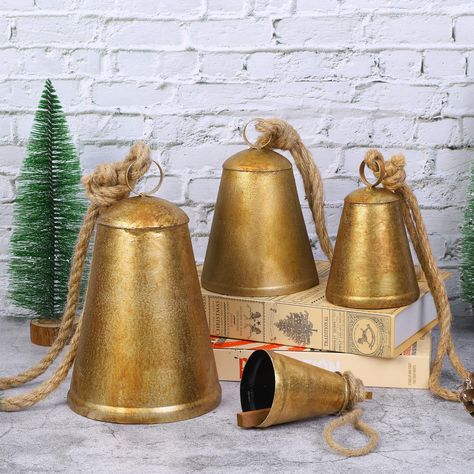 PRICES MAY VARY. Vintage Cow Bells: Immerse yourself in the nostalgia of the holiday season with this set of 4 hanging Christmas cow bell decorations. These bells are meticulously designed to exude a rough and vintage appearance, adding a touch of rustic charm to your festive decor. Great for hanging on Christmas trees, adorning your fireplace, or even gifting to friends, these cow bells make an impression. Versatile Bell Sizes: This set includes 4 bells of varying sizes, offering endless possib Diy Wedding Ornaments, Vintage Cow Bells, Garden Decor Wedding, Metal Cow, Christmas Cow, Bell Decorations, Sleigh Bells, Sleigh Bell, Christmas Mantle