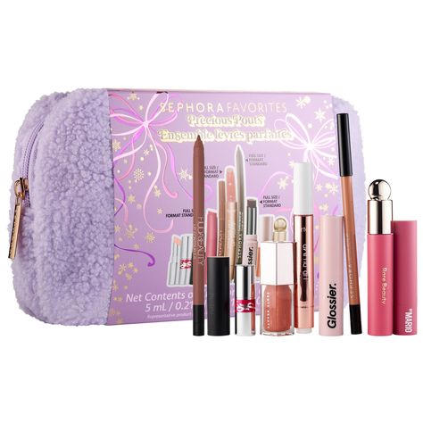 A 9 piece set of lip glosses and liners - includes bestsellers from brands like Rare, Fenty, and Huda Beauty What Else You Need to Know: Discover your signature lip look with this juicy set that includes nine must-have lip products: four full size, four minis, and a deluxe size. Assorted with a range of lip oils, plumpers, and liners, this set is curated with all you need to create the perfect lip for the holidays.