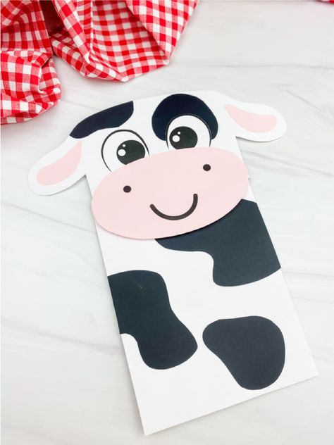 Make this cow paper bag puppet craft with the kids for a farm animal birthday party or study unit! It comes with a free printable template and is great for preschool, pre k, and kindergarten children. Paper Bag Puppet Craft, Paper Cow, Cow Craft, Puppet Craft, Farm Animal Crafts, Scarecrow Crafts, Farm Craft, Farm Animals Theme, Pig Crafts