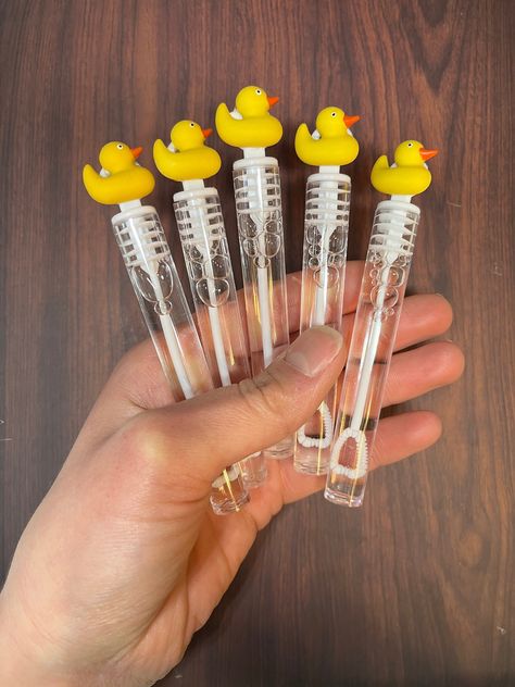 Rubber Ducky favors come in sets of 5 - If you need an amount that is not a multiple of 5, or more than the amounts shown, just message me and I will create a custom link for you to order them!  The ducks are plastic embellishments that are about 1/4 of an inch thick. Bubble Container Size: .14 FL ounces each; 4 inches high (including circular top) x .5 inches wide The bubble containers are made of PLASTIC. * This ships through USPS with a tracking number. Express Shipping Options Available at Checkout for the 48 Contiguous United States. *A rush fee will be added to any order that must be created within 24 hours of ordering and a shipping fee will be added, because the "free standard shipping for orders over $35" no longer applies  Other duck themed items like appetizer skewers, cupcake t Rubber Duck Graduation Party, Rubber Duck Themed Baby Shower Ideas, Rubber Duck Decorating Ideas, Rubber Duck Themed Birthday Party, Rubber Duck Baby Shower Ideas, Duck Themed Birthday Party, Rubber Ducky Baby Shower Ideas, Rubber Ducky Birthday Party, Rubber Duck Birthday Party Ideas