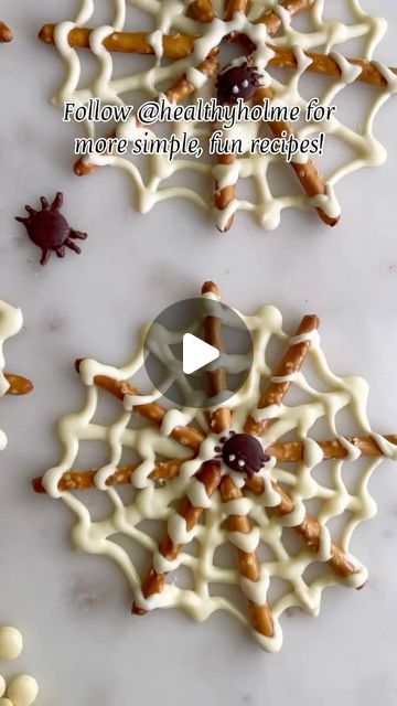 Homeandlifestyletv on Instagram: "If you’re looking for an easy Halloween treat, you’ve got to try these Chocolate Spider Webs I make every year! From @healthyholme  Only 2 ingredients and less than 10 minutes to make!  🌟 Follow for more simple, fun Halloween treats 🌟  🕸 Heat white chocolate chips in a microwave-safe dish until melted, stopping every 30 seconds to stir. 🕸 Pour the melted chocolate into a ziploc bag and cut off a little bit of the corner. 🕸 Line a baking sheet with parchment paper. Put 8 pretzel sticks in a circle. 🕸 Pipe the melted chocolate in a line between each pair of pretzel sticks and in a scalloped circle around the pretzels. 🕸 If desired, add a spider (chocolate chip for body + melted chocolate or chocolate sprinkles for legs) 🕸 Place in the freezer for 10 Halloween Rice Krispie Treats Ideas Spider Web, Pretzel Spiders Halloween, Spiderweb Pretzel Sticks, Halloween Spider Web Pretzels, Halloween Pretzel Spider Web, Pretzel Stick Spider Webs, Marshmallow Pretzel Skeletons, Chocolate Spiders Recipe, Chocolate Pretzel Spider Webs