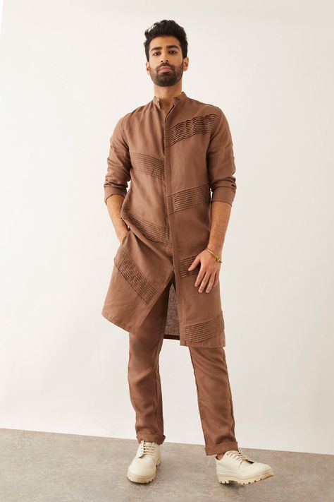 Brown linen kurta with pintuck pleats, band collar and front buttoned placket. Components: 1 Pattern: Solid Neckline: Band Collar Sleeve Type: Three quarter Fabric: 100% Linen Color: Brown Other Details:  Side slits Closure : Front buttons Note : Pant worn by the model is not for sale. Occasion: Mehendi and Puja - Aza Fashions New Pattern Kurta For Men, Lenin Kurta For Men, Kurta Styles Men, Kurta Pattern For Men, Kurta Collar Designs For Men, Mens Kurta Pattern, Brown Kurta For Men, Men’s Kurta, Linen Kurta Men