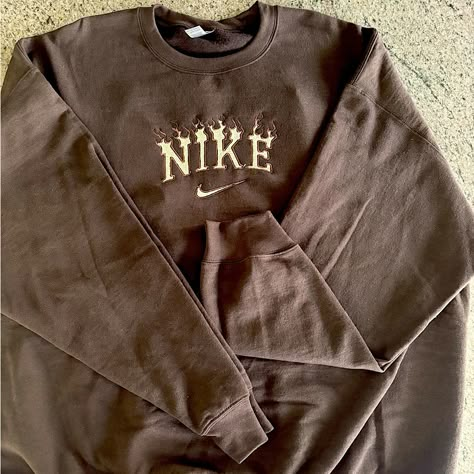 This Brand New Crew Neck Sweatshirt Is 2 Xl And Chocolate Brown. Embroidery Is Light Brown Around Flame And Light Yellow In The Center. Super Soft And Cozy! Clothes Sweatshirts & Hoodies, Crew Neck Nike Vintage, Sporty Brown Cotton Sweater, Oversized Long Sleeve Tops With Embroidered Graphics, Winter Crew Neck Top With Embroidered Logo, Crew Neck Tops With Embroidered Logo For Winter, Long Sleeve Tops With Letter Embroidery For Streetwear, Brown Crew Neck Top With Embroidered Logo, Sporty Long Sleeve Sweatshirt With Custom Embroidery