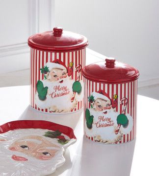 NEW for 2024Santa waves hello on these adorable red and white striped metal cookie canisters! He is a vintage inspired design with bright blue eyes and blushed cheeks, green mittens, and a large candy cane in hand! Perfect to store all of your sweet treats this holiday! Sold as a set of 2. Made by Raz Imports. Made of metal and paper. Dimensions: 6.5"D X 9"H; 6"D X 8"H. Item #: 4411209 Christmas Cookie Jar, Santa Cookie Jar, Green Mittens, Christmas Cookie Jars, Christmas Gingerbread Cookies, Raz Imports, Retro Santa, Santa Cookies, Candy Christmas