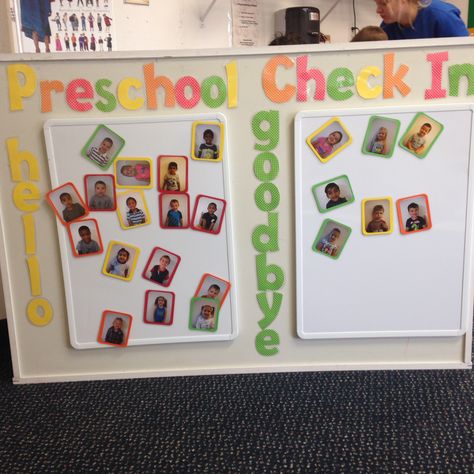 Take a look at this Preschool Classrooms "Sign In and Sign Out Board"  You can find this at our Lansing, MI location! Name Check In Preschool, Preschool Teacher Area In Classroom, Attendance Preschool Ideas, Head Start Classroom Setup, Home And School Chart For Preschool, Check In And Out Board Preschool, Tiny Preschool Classroom Setup, White Board Ideas Preschool, Sign In And Out Preschool