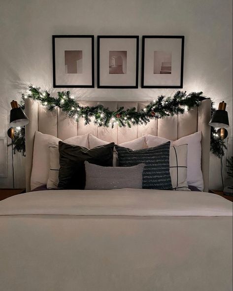 Add a little touch of Christmas to the bedroom with garland. Christmas Garland Bedroom, Christmas Wreath Above Bed, Bedroom Scene, Cozy Christmas Decor, Fabric Headboard, Christmas Tree Garland, Christmas Bedroom, Bed Lights, Alexandria Va