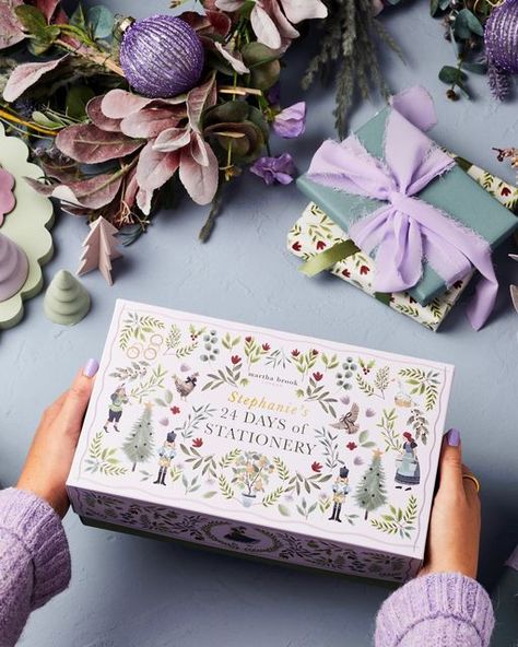 Martha Brook on Instagram: "Blown away by the reaction to our advent calendar, thank you! 💗 Did you know this year’s design has been inspired by the illustrated books from our childhood combined with the Twelve Days of Christmas?! 🌿 All twelve days are hidden on the lid - if you Zoom in, which can you see?! 👀 . Loads of you have signed up to our newsletter for early access on Wednesday THANK YOU! It’s not too late to do so - the link is in our bio! So excited… just 2 days to go! ✨✨✨" Christmas Box Packaging Design, Stationery Advent Calendar, Christmas Hampers Design, Christmas Packaging Design Inspiration, Christmas Box Design Packaging, Christmas Box Design, Christmas Box Ideas, Christmas Packaging Design, Cocktail Book Design