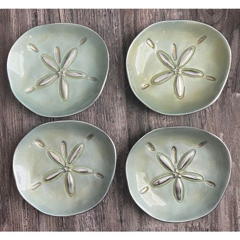 Mariposa is the maker of these 4 coastal themed canapé plates.  All handmade in Mexico, there may be tiny differences between them but they are negligible at best. Color differences to be expected as well. In perfect condition, these will make a splash (haha) at your next summer soirée!  Lined in silver and light aquamarine in color, these are too beautiful!  Dimensions are: 6 x 5.5 x 1  IMPORTANT INFO: - I participate in exclusive sales for our shop followers, so the item you are eyeing may be Sand Dollar Coasters, Ceramic Small Plates, Sea Themed Ceramics, Slab Ceramics Projects, Ceramic Handmade Ideas, Soft Slab Ceramics, Ocean Themed Pottery, Ceramic Sets Ideas, Coastal Plates