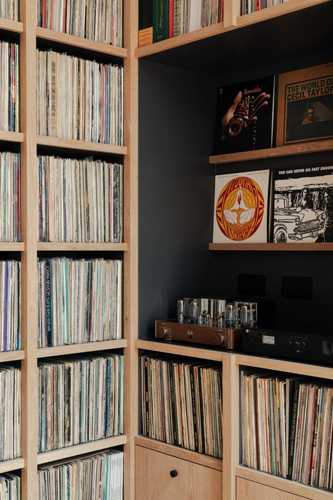 Benjamin Wilkes updates London home with vinyl-filled music room Shelves For Records, Terracotta Flooring, Leather Banquette, Beacon House, Vinyl House, Terracotta Floor, Cabinet Fronts, Paved Patio, London Home