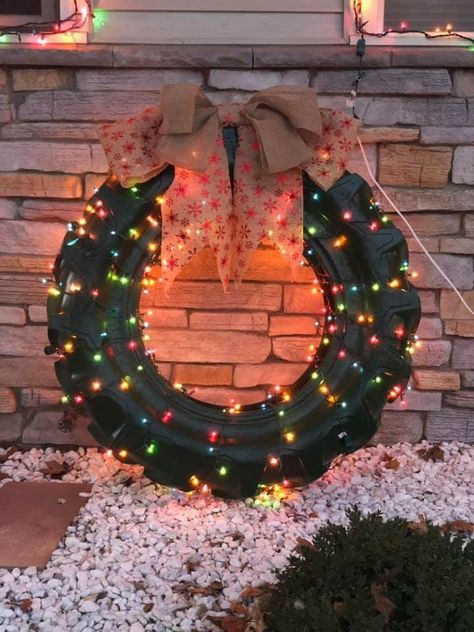 Tractor tire outdoor Christmas decor. So doing it next year! Old Tires Christmas Ideas, Tractor Tires Repurposed, Tractor Tires Ideas, Truck Tire Ideas, Tractor Tire Wreath Christmas, Tractor Tire Christmas Decoration, Round Bale Christmas Decorations, Tire Decor Ideas, Tractor Tyre Ideas