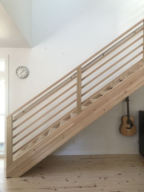 Horizontal stair railing on glulam staircase. All fir. Slats are 1x2 and handrail is 2x4. Super easy, inexpensive and beautiful scandi modern. 2x4 Stair Railing Ideas, Modern Oak Stair Railing, 2x4 Stair Railing, Staircase Horizontal Railing, 2x4 Railing Ideas, Horizontal Railing Interior, Easy Diy Stair Railing, Inexpensive Stair Railing, Modern Wooden Stair Railing