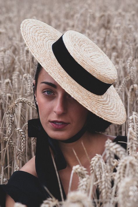 Straw Canotier hat inspired by the style of 1900 . This beautiful hat is ideal for any occasion. An elegant hat for weddings, social events, horse races and summer parties. *Design :  This hat is made with high quality materials , using traditional millinery tecniques. all our hats are hand sewn and so each hat is unique. *Description : It's a hat with a flat brim and low oval top, attached to the head with a black velvet loop that can be tied around the neck or behind the head.   This hat has Bergere Hat, Canotier Hat, Summer Hat Style, Hat With Ribbon, Straw Boater Hat, Straw Boater, Future Wardrobe, Edwardian Style, Elegant Hats