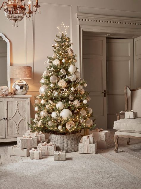 Give your Christmas tree a lovely rustic finishing touch with our Willow Christmas Tree Ring. A stylish alternative to having unsightly tree stands on display, this natural willow piece is suitable for trees up to 8 feet tall. A gentle grey washed finish softens the appearance of the willow,  which will blend effortlessly into any festive scheme.    Explore all of our Elegance Era Christmas trend. Champagne Christmas Tree, Christmas Tree Ring, Luxury Christmas Decor, Elegant Christmas Tree Decorations, Christmas Tree Inspo, Luxury Christmas Tree, Cozy Christmas Decor, Elegant Christmas Trees, Christmas Themes Decorations