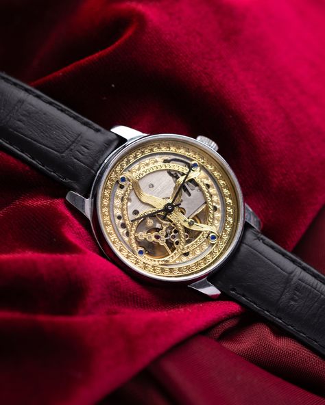 This customized Pobeda watch, with a 37 mm case, boasts a mesmerizing handcrafted skeleton dial that captures the beauty of celestial motifs. The intricate golden patterns etched into the dial evoke images of the cosmos, giving the timepiece an artistic and ethereal quality. The open-worked design of the dial not only enhances its aesthetic appeal but also provides a fascinating view of the inner mechanical workings, making it a true conversation piece. The watch's case is made from polished stainless steel, offering both durability and a sleek, modern look that contrasts beautifully with the ornate dial. This sturdy 37 mm case frames the celestial motif perfectly, ensuring that the dial remains the centerpiece of the design. Paired with a classic black leather strap, the watch exudes soph Celestial Motifs, Watch Gift For Him, Watch Gift Box, Skeleton Watches, Men's Vintage Watch, Retro Watches, Watch Gift, Vintage Watches For Men, Buy Watches