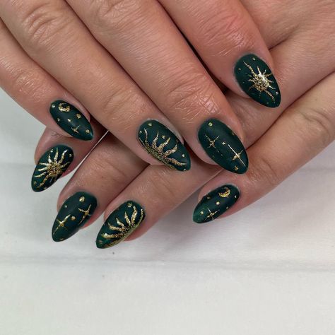 Dark Green Nails with Sun, Moon, and Stars Sun Moon And Stars Nail Art, Dark Green Celestial Nails, Nail Ideas Dark Green And Gold, Nail Inspo Celestial, Sun On Nails Art Designs, Gold And Forest Green Nails, Dark Moon Nails, Halloween Celestial Nails, Blue Gold And Black Nails