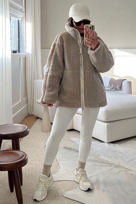 Cozy coffee run outfit idea linked here. Womens outfit inspo, what to wear, casual chic outfit, neutral outfit, leggings outfit, new balance sneakers, sherpa jacket outfit, baseball cap outfit idea, womens fashion trends 2023.