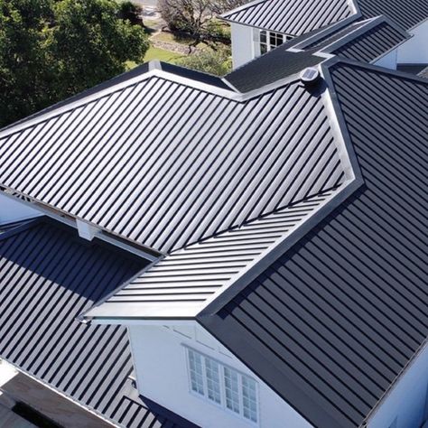 this image shoes a metal roof, shown from above. the roof is grey. Colorbond Cladding, Sheet Metal Roofing, Roof Pitch, Roof Restoration, Best Roofing, Leaky Roof, Brochure Design Layout, Corrugated Roofing, Commercial Roofing