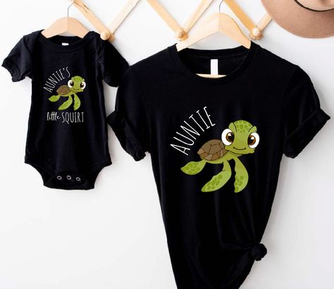 Matching Auntie & Baby Niece Shirts, Auntie And Niece Nephew T-Shirt, Auntie Day Celebration Shirt, Cute Gift For Aunt From Niece and Nephew Welcome to BelinayShirt,  Your ultimate destination for unique and stylish printed t-shirts! At BelinayShirt, we believe in expressing individuality through fashion. Our collection features a wide range of designs, from trendy graphics and bold statements to artistic prints and personalized options. Each shirt is crafted with high-quality materials to ensure comfort and durability. Whether you're looking to make a fashion statement or find the perfect gift, BelinayShirt has something for everyone. Discover your new favorite tee today and wear your personality with pride! Aunt And Niece Shirts Matchizz, Aunt And Niece Shirts, Auntie And Niece, Aunt Announcement, Nephew Shirts, Baby Shower Shirt, Auntie Baby, Matching Birthday Shirts, Baby Shower Shirts