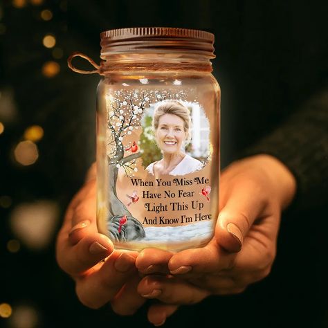 The Custom Photo Mason Jar Light is more than just a luminary; it's a heartfelt memorial and a cherished gift for any occasion. Customizable with a photo and the touching message "When You Miss Me, Have No Fear, Light This Up And Know I'm Here," it serves as a beacon of comfort, especially for those coping with the loss of a loved one. This unique product encapsulates memories and emotions, making it an unforgettable gift for family members, be it for a father, mother, or anyone dear on any occa Memorial Crafts For Loved Ones, Jar Lamps, Memory Jars, Mason Jar Light, Holiday Homework, Personalized Mason Jars, Memory Jar, You Miss Me, Craft Market