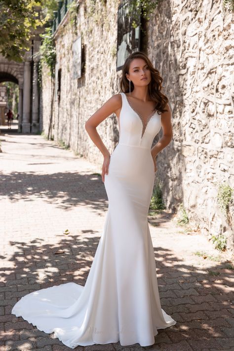 Sophisticated, soft, form fitted mermaid style gown. V-neck, sleeveless, long train, and open back. Special feature is the sexy slits under arms. Wedding Dresses Sheer, Cathedral Wedding Dress, Wedding Gown Backless, Satin Bridal Gowns, Sheer Wedding Dress, Minimalist Wedding Dresses, Mermaid Wedding Dresses, Backless Wedding, Wedding Dress Fabrics