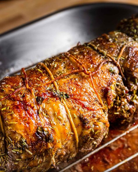 Boneless leg of lamb is stuffed with a mixture of rosemary, parsley, and minced garlic, then rolled and roasted until medium-rare. Tender, juicy, and full of flavor, this lamb is perfect for the holidays, especially Easter, and is great alongside roasted potatoes and a salsa verde. #lamb #easterfood #dinner Roasted Leg Of Lamb With Potatoes, Stuffed Leg Of Lamb Recipes, Stuffed Lamb Leg, Stuffed Lamb Roast, Deboned Leg Of Lamb Recipes, Boneless Lamb Loin Roast Recipes, Lamb Loin Roast Recipes, Boneless Leg Of Lamb Recipes, Lamb Loin Roast