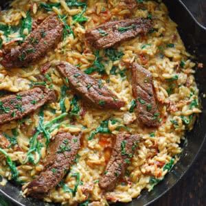 Flank Steak with Creamy Orzo (30 Minutes, One-Pan) - Julia's Album How To Reheat Steak, Orzo Spinach, Kinds Of Steak, Creamy Orzo, Paprika Sauce, Orzo Recipes, Cucumber Tomato Salad, Sliced Steak, Cooking Temperatures