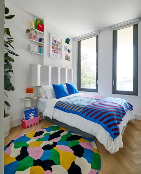 Tour a Bold Bushwick Apartment Exploding With Color | Apartment Therapy Wavy Headboard, Color Apartment, Blanket On Bed, Spanish Aesthetic, Room With Color, Colourful Bedroom, Multicolored Rug, Striped Blanket, Colorful Apartment