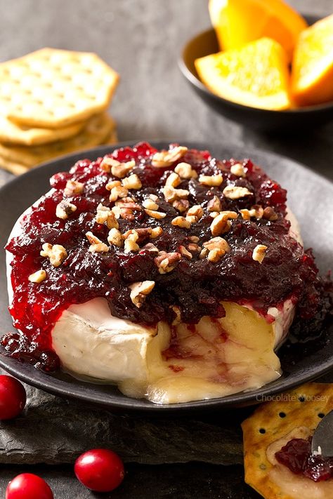 The easiest snack you can make for entertaining holiday guests - Cranberry Baked Brie served on a festive cheese board with crackers and fruit. Ooey gooey cheese ready in 10 minutes! Baked Brie With Cranberry Sauce, Brie With Cranberry Sauce, Baked Brie With Cranberry, Cranberry Baked Brie, Cheese Board Ideas, Baked Brie Recipes, Cranberry Baking, Thanksgiving Leftover Recipes, Leftover Cranberry Sauce