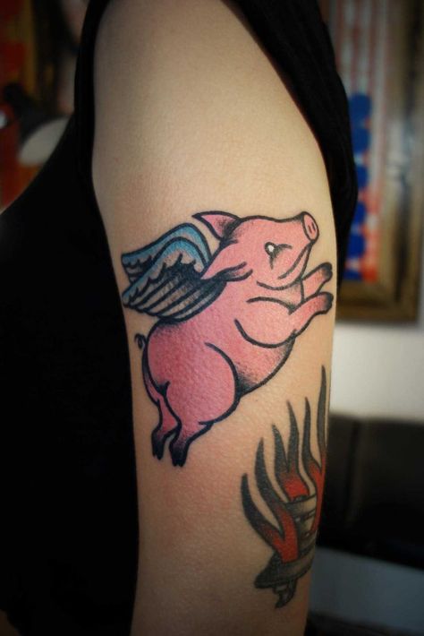 Flying pig tattoo on the left upper arm Flying Pig Tattoo, Sheep Tattoo, Pig Tattoo, Ribcage Tattoo, Flying Pig, Best Friend Tattoos, White Tattoo, American Traditional Tattoo, Friend Tattoos