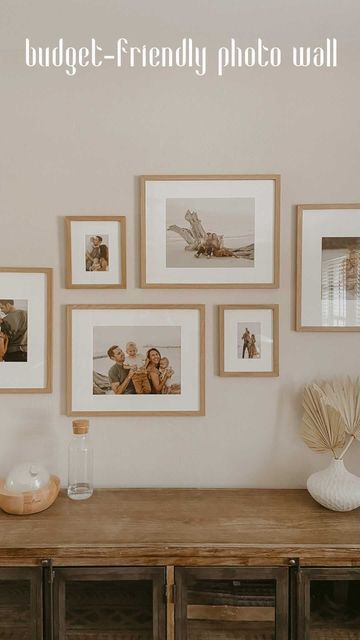 Light Wood Frames On Wall, Small Wall Family Picture Ideas, Simple Family Photo Display, Natural Wood Gallery Wall, Light Wood Gallery Wall, Gallery Wall Oak Frames, Japandi Picture Frames, Wood Frame Photo Wall, Simple Family Photo Wall