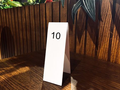 Metal Table Number - Wedding Signs - Cafe Numbers - Restaurant Supplies - metal Signs - Modern Minimalist numbers - Table Number Simple, functional, and beautiful table numbers for your cafe, wedding or event. These minimalist aluminum table numbers are essential restaurant supplies that will make your space great! It's also easy to stock Constructed from high-quality powder coated aluminum base.   Each set of Table Numbers contains : 1-5 stands with numbers  1-10 stands with numbers  1-20 stand Restaurant Table Numbers, Table Number Signs, Cafe Wedding, Metal Numbers, Signing Table Wedding, Wedding Numbers, Reserved Signs, Restaurant Tables, Aluminum Table