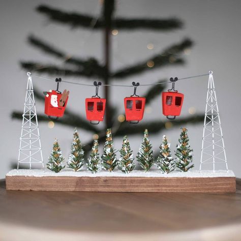 Made from reclaimed wood this gorgeous handmade Christmas scene features Father Christmas in one of four cable cars over a beautiful snowy alpine scene. These beautiful festive decorations, that have been made within Fairtrade standards, will look great hanging anywhere in your home and would add a touch of Christmas magic wherever they are placed. Your order will be wrapped in crisp white tissue paper, sealed with a Nest label, and include a gift tag.If you include a gift message with your orde Christmas Art Projects, Homemade Christmas Decorations, Holiday Tree Decorations, Pinterest Diy Crafts, Cable Cars, Cable Car, Gorgeous Christmas, Christmas Scene, Winter Scene