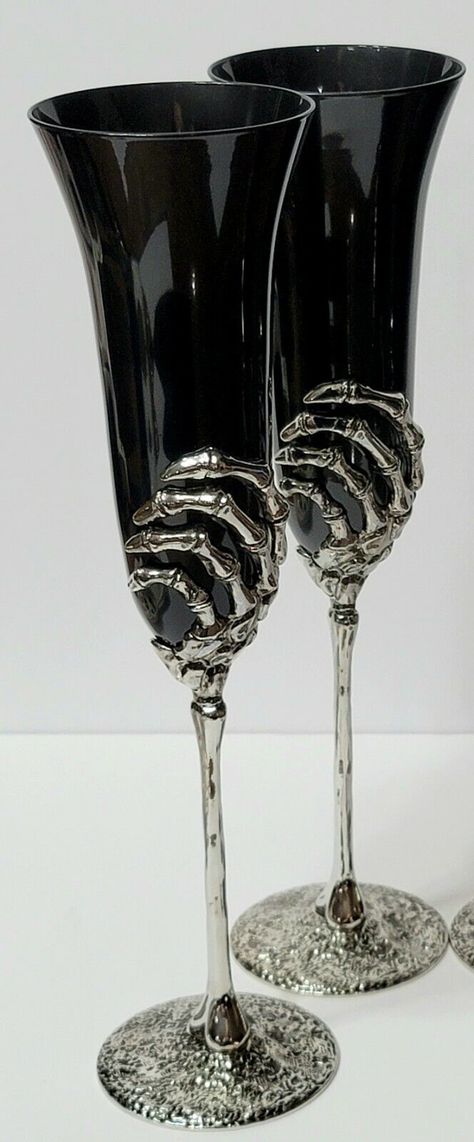 Very Elegant Black Glass Champagne Flutes with Silver Metal Skeleton Hand Wrapped Around Glass Perched on a Bone Stem 11 1/2" Tall 3" Opening 5" Metal Stem Set of 2 Champagne/Toasting Flute Gothic Wedding Glasses, Goth Wedding Favors, Skull Wine Glasses, Metal Skeleton Hand, Black Wedding Favors, Painted Champagne Flutes, Witchy Wedding, Wiccan Wedding, Wine Chart