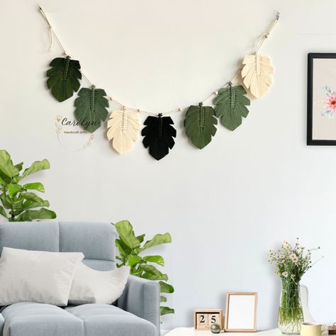 Enhance your space with a touch of organic allure using our Green Leaves Macrame Garland! An excellent option for Nursery Decor, Kid Room Decor, or Farmhouse Decor, this Macrame Wall Hanging seamlessly complements Boho Home Decor, making it a distinctive Christmas Gift. It's an ideal addition to Safari Nursery Decor or a Jungle Theme Nursery! This Boho Bunting serves as a perfect yet beautifully unique gift for your loved ones, such as friends or family. The Feather Garlands are meticulously cra Boho Bunting, Leaves Macrame, Macrame Leaves, Feather Garland, Jungle Theme Nursery, Macrame Garland, Safari Nursery Decor, Theme Nursery, Green Theme