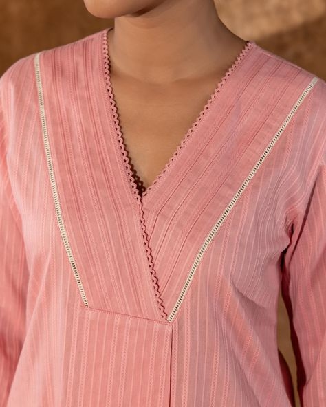 Summer collection - New Arrivals! The Apurva Kurta from our Rangsutra range features a perky shade of baby pink beautifully offset with delicate details of white ladder lace and a subtle pattern of tone-on-tone stripes. [ Cottons Jaipur, Cotton, Solids, Handmade Kurtas, Everyday-wear, Summer staples ] #cottons #cottonsjaipur #newarrivals #floral #summer #summer2024 #handcraftedkurtas #comfortfits #cottonsuitset #summertime #summerstaples #solids #solidkurtas #summerfloral #cottonkurta #em... Kurta Neckline, Cottons Jaipur, Long Kurta Designs, Lace Designs On Suits, Suits For Women Indian, Saffron Threads, Salwar Neck Designs, Angrakha Style, Gala Design