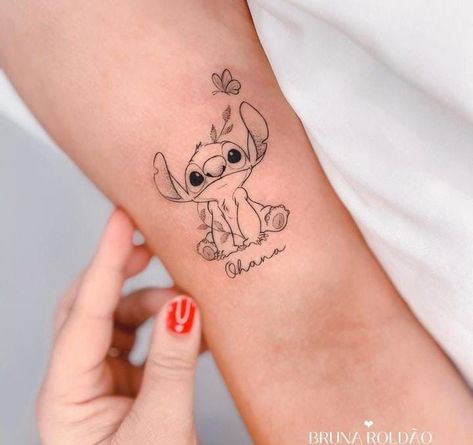 Disney Back Tattoo, Small Stitch Tattoo, Ohana Stitch Tattoo, Disney Stitch Tattoo, Black Men Tattoos, Back Of Arm Tattoo, Stitch Tattoo, Hand Tattoos For Girls, Writing Tattoos