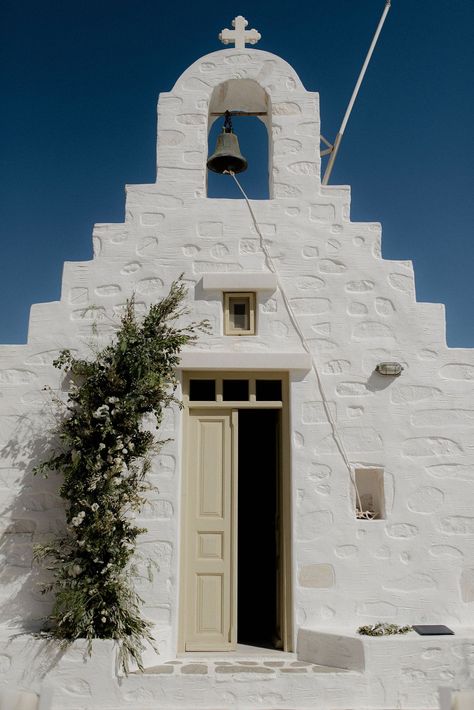 White wedding chapel in Paros, Greece at destination wedding with green and white flower arrangements Greek Chapel Wedding, Wedding Greek Style, Small Greek Wedding, Greek Destination Wedding, Greek Wedding Flowers, Antiparos Wedding, Greek Wedding Aesthetic, Greece Wedding Aesthetic, Green And White Flower Arrangements