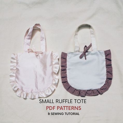 Three sizes of the Ruffle Tote bag PDF sewing pattern with tutorial. Instant download, print at home and sew!  A cute bag with a frill in small, medium and large size.  A great all rounder and so quick and easy to make.  Choose to make it with or without the bow. The finished bag size is: 23cm x 25cm / 9" x 10" ~ strap drop: 16cm / 6.3" Product details: Computer drafted professional patterns to download and a 17 page instruction booklet which includes colour photos of every step, instructions on how to print the pattern, fabric tips and pattern layout guide. The printable pattern comes in A4 and US Letter PDFs. The tutorial comes in metric and imperial measurements. Skill level: Advanced beginner - once you have the ruffle made it's very easy. Fabric Requirements: 65cm x 112cm / 26" x 45" Tote Bag Sewing Patterns, Ruffle Bag, Ruffles Bag, Pattern Layout, Diy Tote, Beginner Sewing, Diy Tote Bag, Cute Diy, Summer Bag