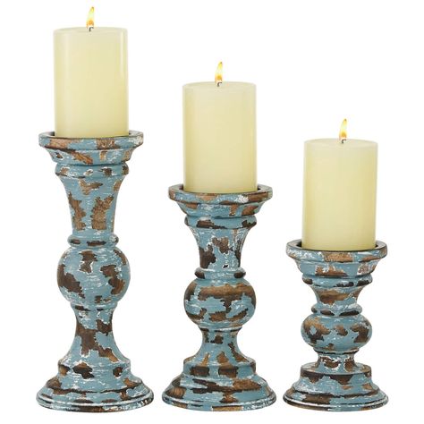 "Buy this Light Blue & Brown Mango Wood Country Cottage Candle Holder Set at Michaels. com. Add instant warmth and an inviting ambiance with this set of 3 pillar candle holders. Add instant warmth and an inviting ambiance with this set of 3 pillar candle holders. This set is a great addition to any rustic-inspired interior and will surely complement your existing home décor. With wide candle platforms and curved bodies along with a light blue and brown finish, these wood candle holders work beau Brown Candle Holders, Wooden Pillar Candle Holders, Wood Pillar Candle Holders, Wooden Pillars, Coloured Candles, Rustic Candle Holders, Wood Candle, Rustic Candles, Wooden Candle Holders