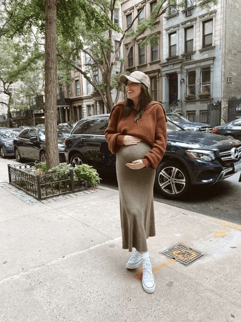 Bump-Friendly Fall Outfits- maternity, maternity outfits ideas, bump style, women's fashion, style, fashion, midi skirt, hat, sneakers, high top converse outfit, skirt, sweater, sweater outfits, fall outfits, fall outfits 2021 | @prettyinthepines, New York City Maternity New York Outfit, Preggo Fall Outfits, Dress And Sweater Outfit Pregnant, Chic Bump Style, Maternity Athleisure Outfits Fall, Pregnant Street Style Fall, New York Maternity Outfits, Dress With Sweater Over It Maternity, Dress With Sweater Over It Pregnant