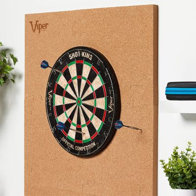 The simplest solution yet to protecting your wall from errant dart throws is here with the defender dartboard surround! This stylish v-foam surround requires no installation tools, just snap it together around your dartboard and you are ready to play! This tough and durable defender will stand up to the most wicked throws, should an errant throw slip by. The cork sheet adorning this board will brighten up your room and look good protecting your walls. Take the guesswork out of deciding which boa Dart Backboard, Cork Dartboard, Dartboard Surround, Dart Board Wall, Tungsten Darts, Electronic Dart Board, Dart Board Cabinet, Cork Sheet, Dart Board