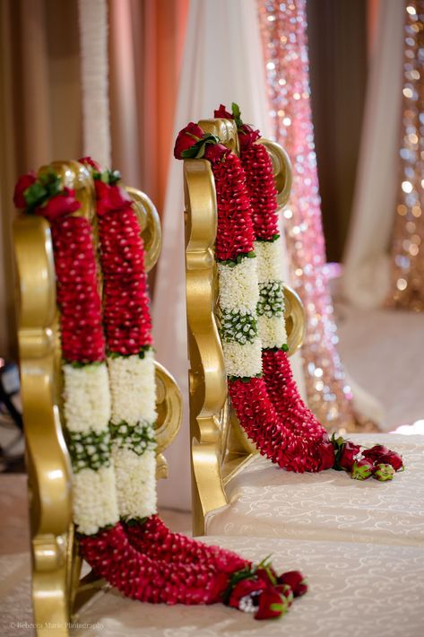 Aon Ballroom Wedding - Hindu celebration - Rebecca Marie Photography  Esha & Kapil's wedding at Aon Ballroom and Navy Pier in Chicago featured gorgeous traditional details, friends and family coming together, and a color palette of blush, bright pink, turquoise, magenta, and ruby. Hindu Wedding Mala, Pink Stage Decorations, Marriage Malai Design, Hindu Wedding Garland, Wedding Malai Design, Marriage Garlands, Wedding Garlands Indian, Varmala Indian Weddings, Garland Wedding Indian