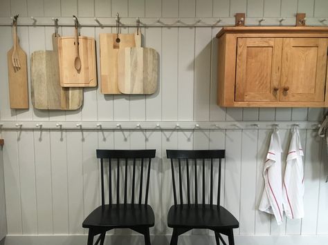 Shaker style peg racks in a guest home kitchen.  Stone House Revival - Season One. Stone House Revival, Peg Rails, Shaker House, Shaker Peg Rail, Kitchen Stone, Peg Rail, Kitchen Cabinet Trends, Shaker Pegs, Colonial Kitchen