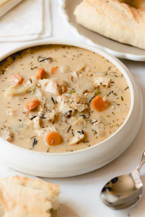 Discover how to recreate the beloved Creamy Panera Chicken and Wild Rice Soup at home with this easy copycat recipe! Chicken Wild Rice Soup Panera Copycat, Hardy Winter Meals, Panera Bread Chicken And Wild Rice Soup, Copycat Restaurant Recipes Soup, Panera Chicken And Wild Rice Soup, Creamy Wild Rice Chicken Soup, Hardy Soups, Camp Soup, Chicken Avocado Melt