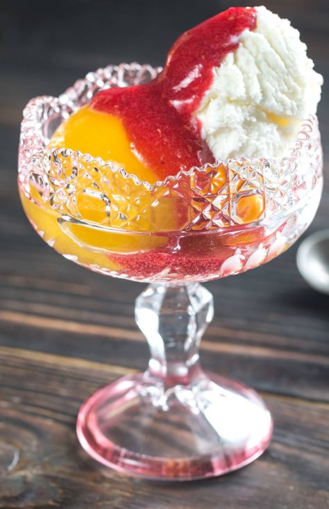 Impossibly Delicious Peach Melba?utm_source=12tomatoes Peach Melba Recipe, Poached Peaches, Peach Melba, Peach Salsa, Berry Sauce, Peach Desserts, Raspberry Sauce, Vanilla Bean Ice Cream, Ice Cream Bowl