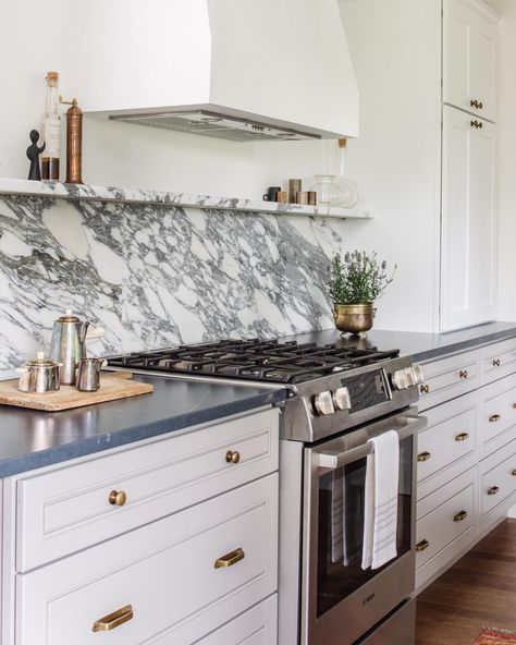 There’s nothing about a Monday that a  fantastic piece of stone can’t fix! Did you know we’re your source for stone to top our gorgeous cabinets? We have specialists on our team who can find just what you’re looking for to create your one-of-a-kind kitchen! • • design: @alison_giese • photo: @radifera • cabinets & Stone: @uniquekitchensandbaths Classic Farmhouse Kitchen, Mindy Gayer Design, Farmhouse Kitchen Island, Kitchen Island Design, Kitchen Tile, Unique Kitchen, Counter Tops, Farmhouse Kitchen Decor, Range Hood