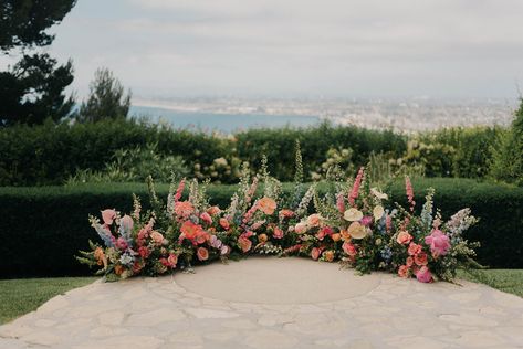 May Wedding Arch, Florals On Ground Wedding, Altar Ground Flowers, Elopement Ceremony Flowers, Ground Floral Arch Ceremony, Ground Flowers Ceremony, Wildflower Alter Arrangements, Wedding Ground Floral Arch, Grounded Floral Arches Beach