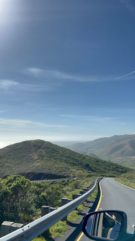 Car driving down a road that goes over pretty hills in california Driving In La Aesthetic, Pretty Road Aesthetic, Road Trip Aesthetic Mountains, California Hills Aesthetic, Hidden Hills Aesthetic, California Mountains Aesthetic, Mountain Road Aesthetic, Agora Hills Aesthetic, California Road Trip Aesthetic