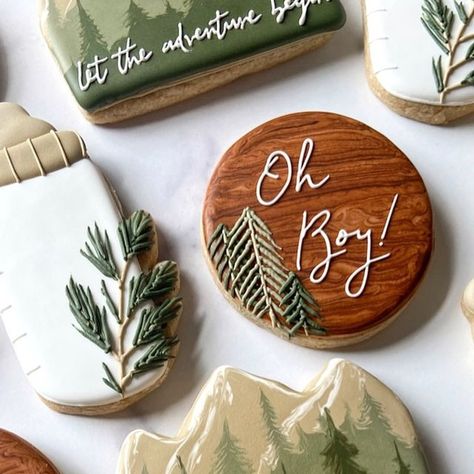 Jessica on Instagram: "🏔️While I often include a lot of variety in my orders, I also love the challenge of trying to put together an interesting set of cookies using only a few designs. The balance of these 3 together ended up really working out, and I couldn’t wait for the client to pick them up!  The intention was to try and keep all the designs on the simpler side, but I couldn’t help myself with that tree line idea. I love how they turned out🫶🏻  🌿Greenery Baby Bottle cutter available at HartworkCookieCo.com (link in bio) . . . . . . #babyshowercookies #cookiecutters #babyshower #letheadventurebegin #adventurecookies #mountaincookies #cookiedecorator #cookiedecorating #cookieart #royalicingcookies #royalicing #sugarcookies #decoratedsugarcookies #decoratedcookies #sugarcookiesofinst Greenery Cookies Decorated, Let The Adventure Begin Cookies, Adventure Baby Shower Cookies, Pine Tree Cookies, Woodland Baby Shower Cookies, Adventure Baby Shower Theme, Specialty Cookies, Baby Boy Cookies, Hunting Baby