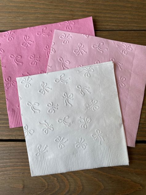 Perfect touch to your shower or get together!  Hand embossed napkins:  Each napkin folded measures 5" x 5" Drink/Cake napkin Each set contains 20 embossed napkins If you need a certain color that you don't see, please message me prior to purchase.  *If you would like half you order one color and the other half another color, just put that in the notes section, I'm happy to help!  Example: 10 light pink 10 white (20 napkins per set) Pink Ribbon Baby Shower Theme, Princess First Birthday Party Decorations, Places To Have Birthday Parties, Bailarina Birthday Party, Girly Party Decor, Birthday Party Mood Board, Sweet 16 Bow Theme, Pink Bow First Birthday Party, Pink Backyard Party